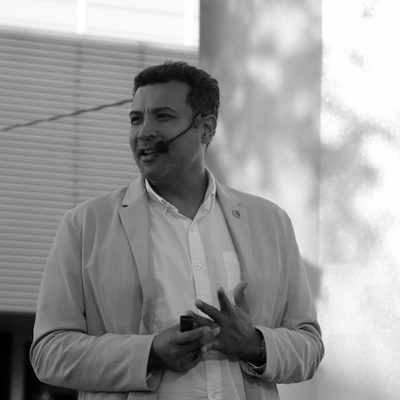 Ulrick speaking at an outdoor talk
